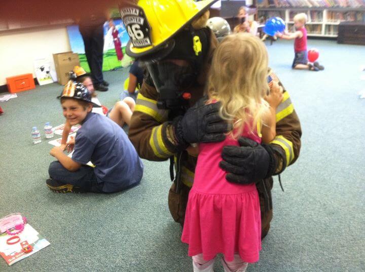 Claire hugs the scary fireman